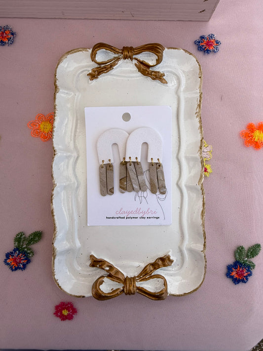 White Arches with Little Brown Dangle Pieces