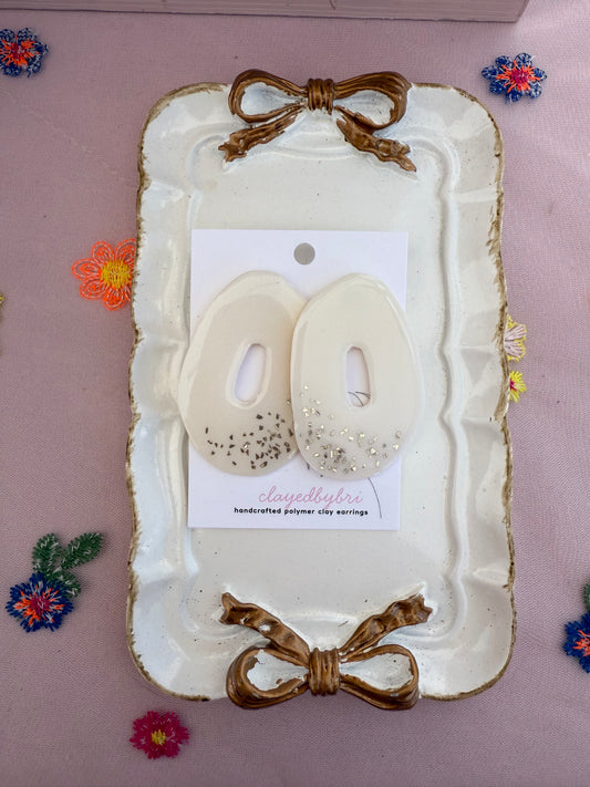 Off-White Oversized Ovals with Silver Glitter